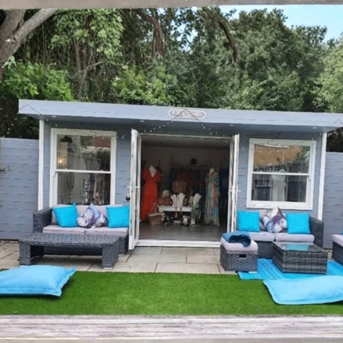 Garden room used as a boutique with bifold doors open